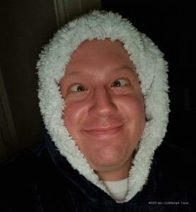 The author pulling a cross-eyed funny face while wearing a teddy fleece hoodie.